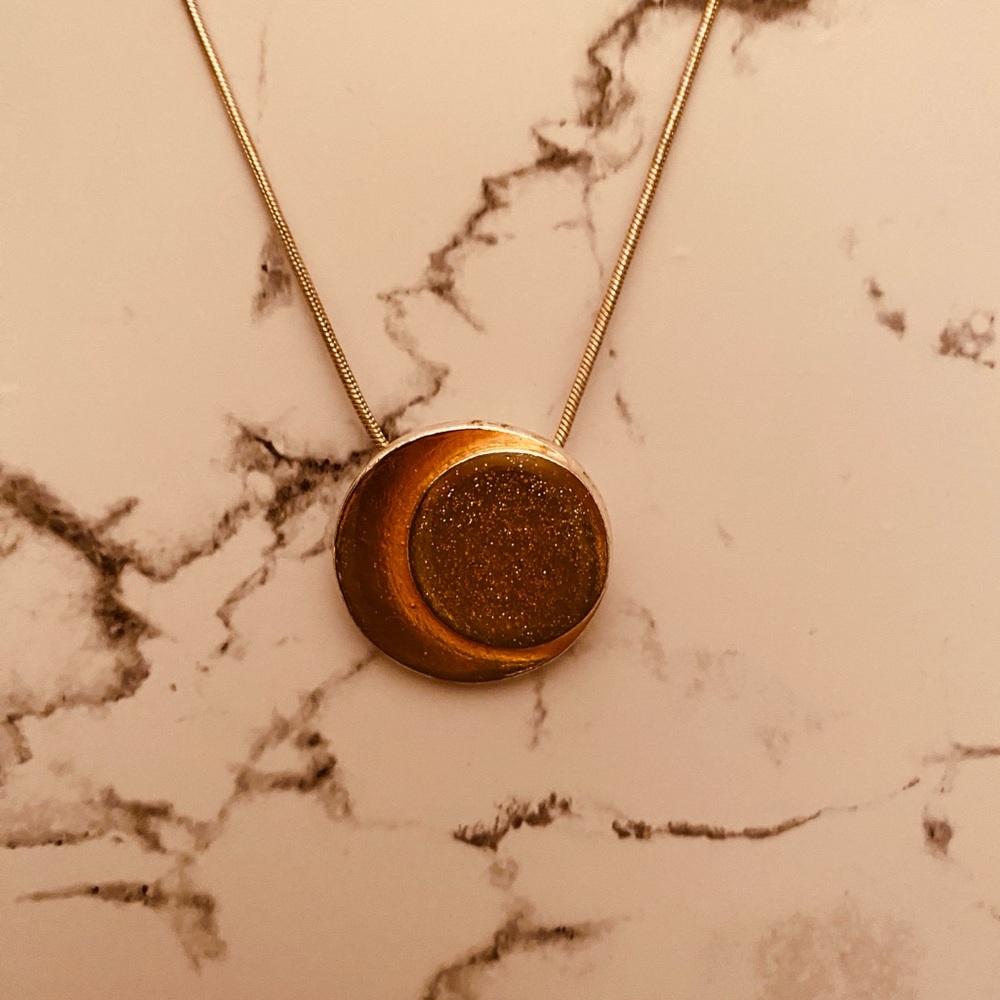 Skalli circa 2006 necklace and matching earrings made of metal and resin.